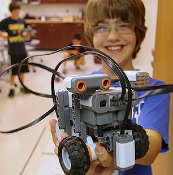 Child holding robot