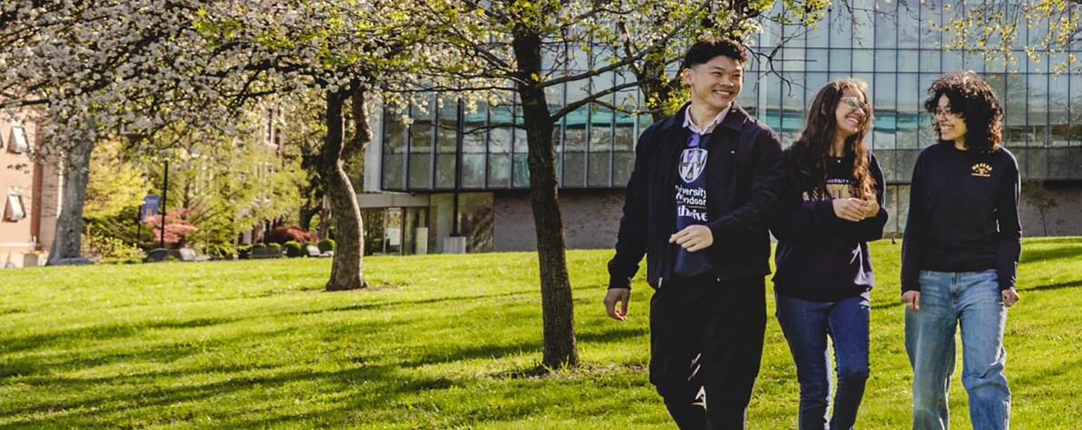 happy students strolling through campus