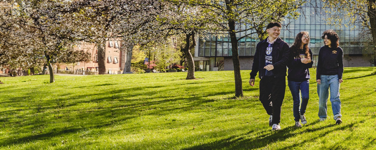 happy students strolling through campus