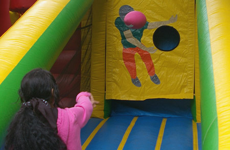 student throwing football