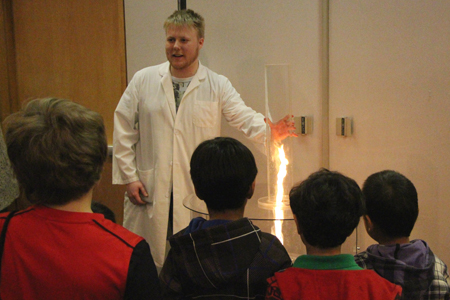 kids watching fire tornado