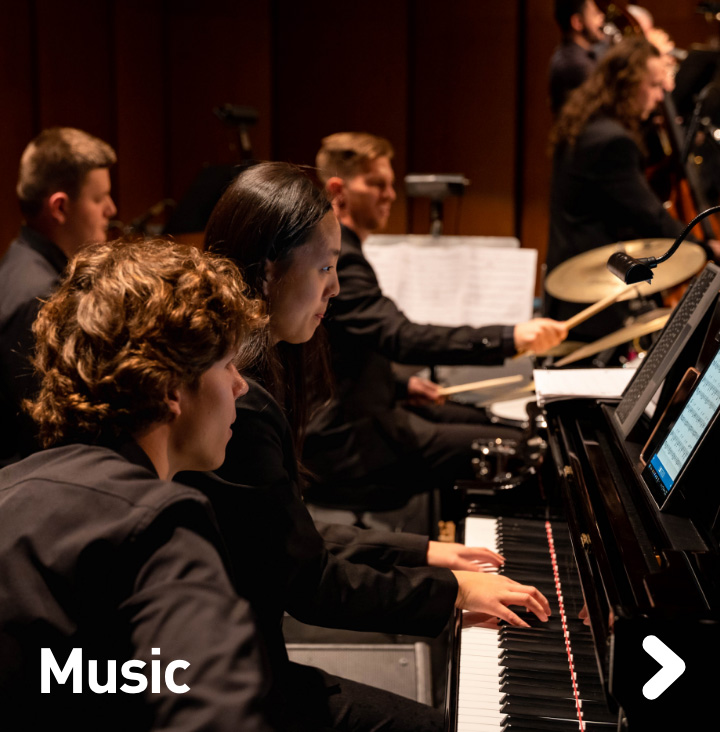 Close up of pianist and drummer in an orchestra.