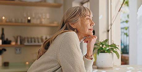 Mature lady looking out window