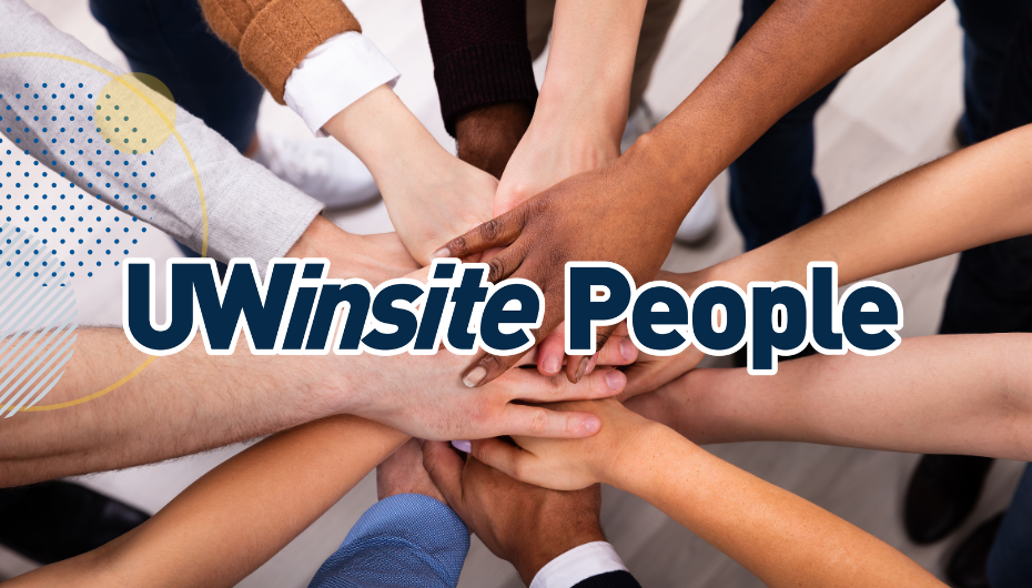 Multi-ethnic hands stacked on one another with a text overlay Uwinsite People