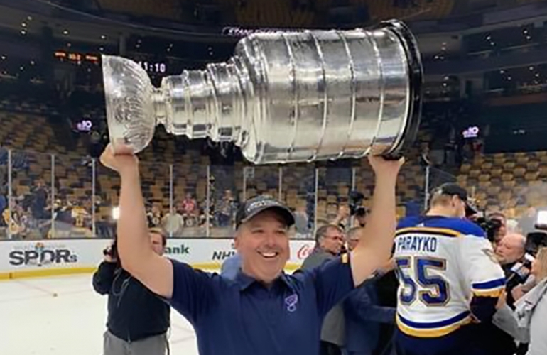 UWindsor grad Michael Murphy, chiropractor for the St. Louis Blues, hoists the Stanley Cup after the team won its first-ever NHL title.