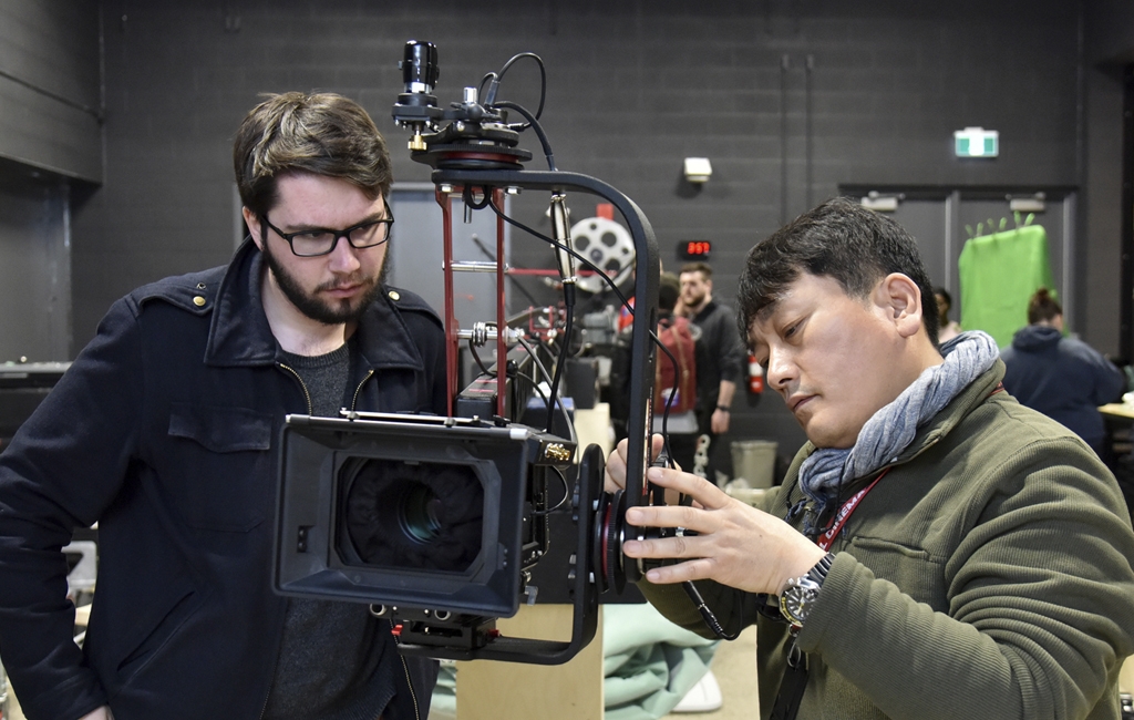 Film production Professor Min Bae (right) works with a student in his Motion Picture Technologies course