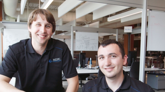  Recent graduates Matthew Lapain and Vincent Colussi are shown working at the Epic Innovation office in the Joyce Entrepreneurship Centre at the University of Windsor.